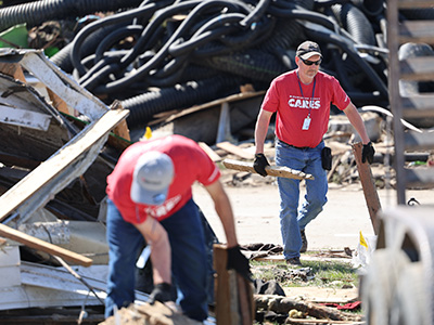 MidAmerican CARES volunteers assisting with cleanup efforts in Greenfield, Iowa