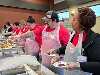 MidAmerican employee volunteers serving meals