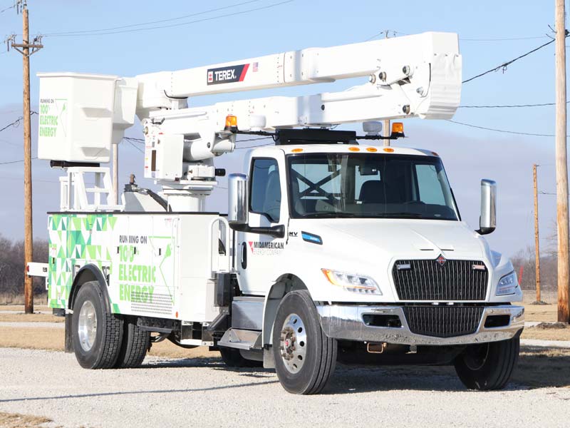 Electric bucket truck with arm collapsed